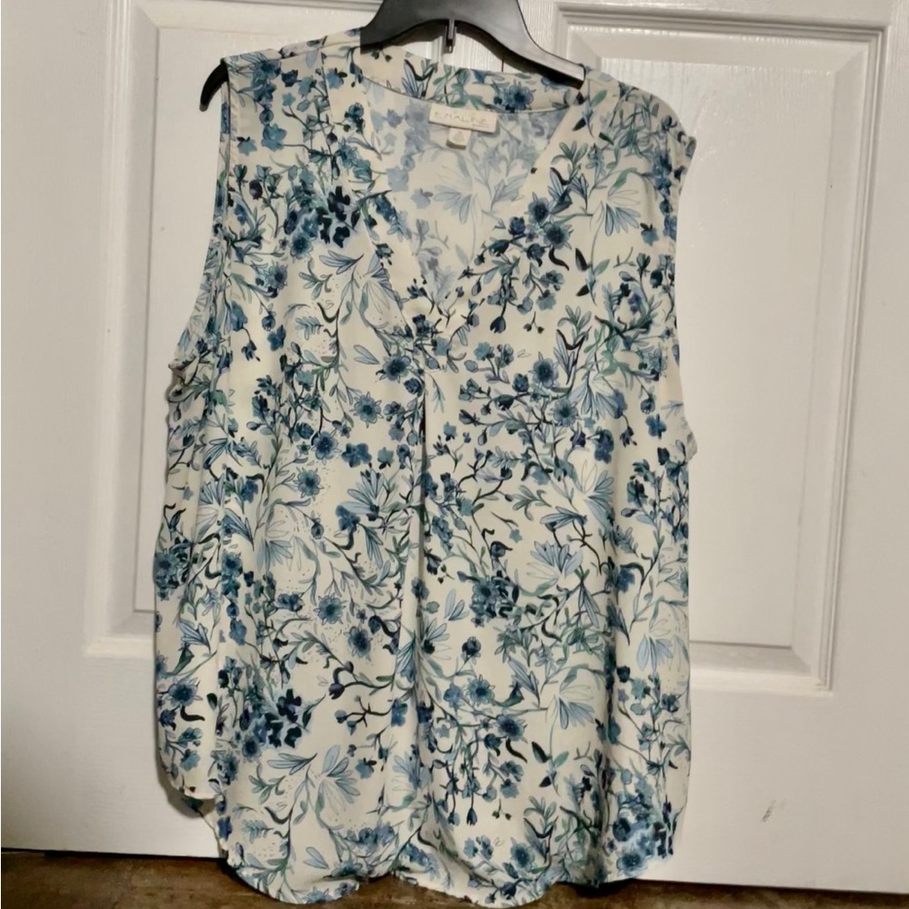 Woman’s Emmaline sleeveless top. Size 2x. Cream colored with light blue flowers.